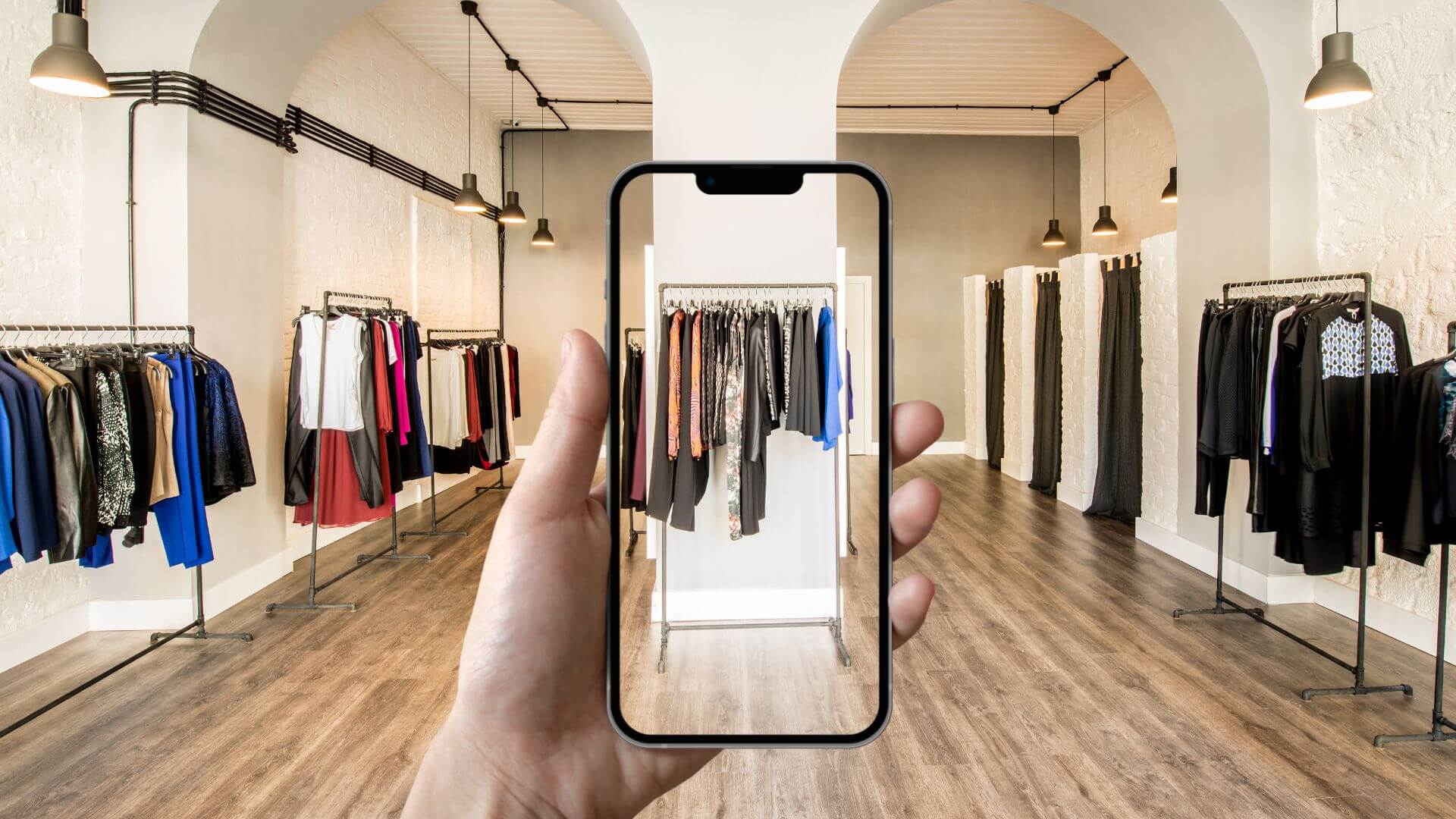 What Is A Sales Funnel? Matrix Internet A hand holding a smartphone in front of clothes rack, using visual search to identify items