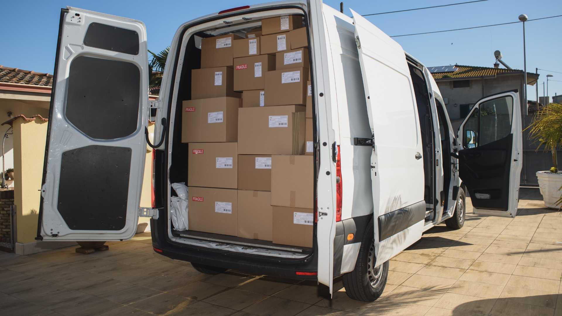 From cart to doorstep: Master your eCommerce shipping game Matrix Internet A white delivery van with its doors open, loaded with cardboard boxes
