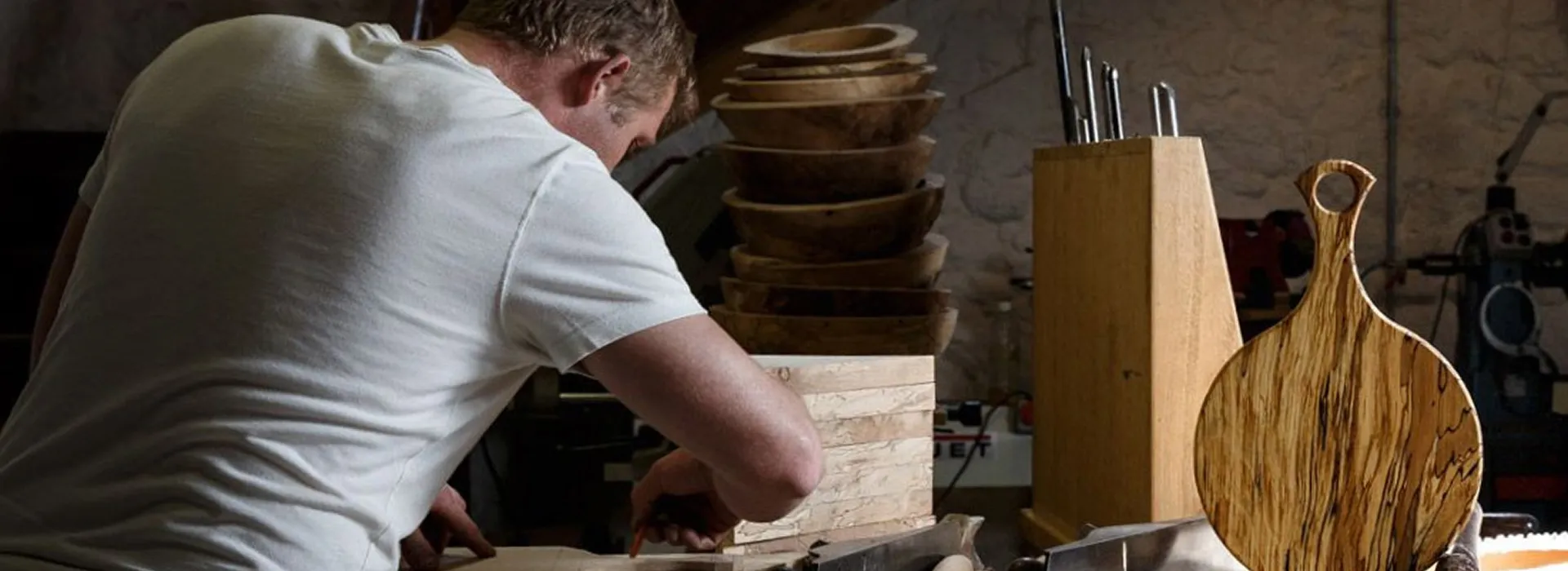 Image of a man woodworking