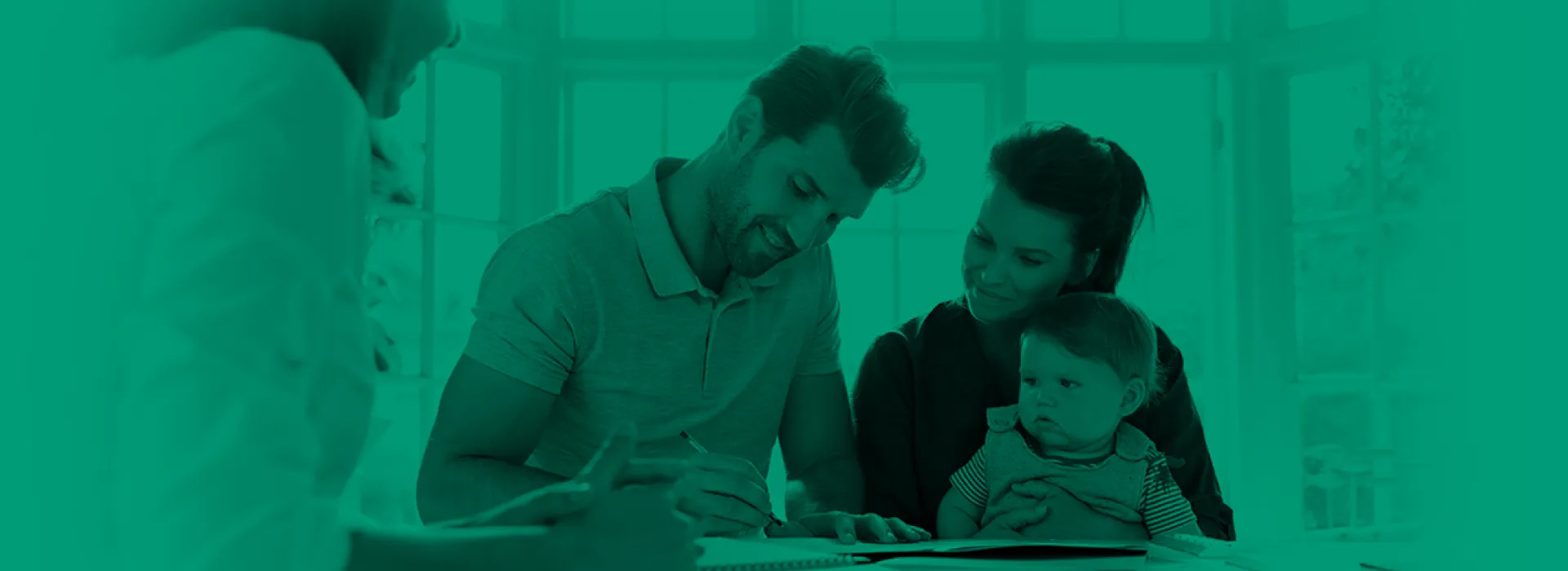 Family signing a contract on the table